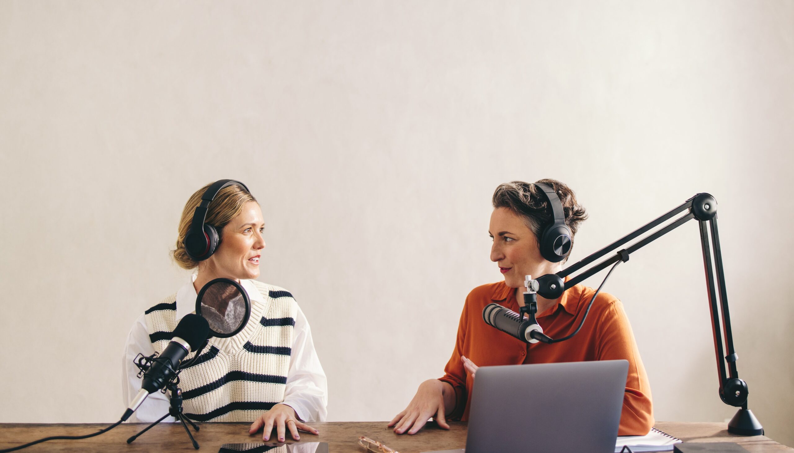 Two female podcasters on a discussion